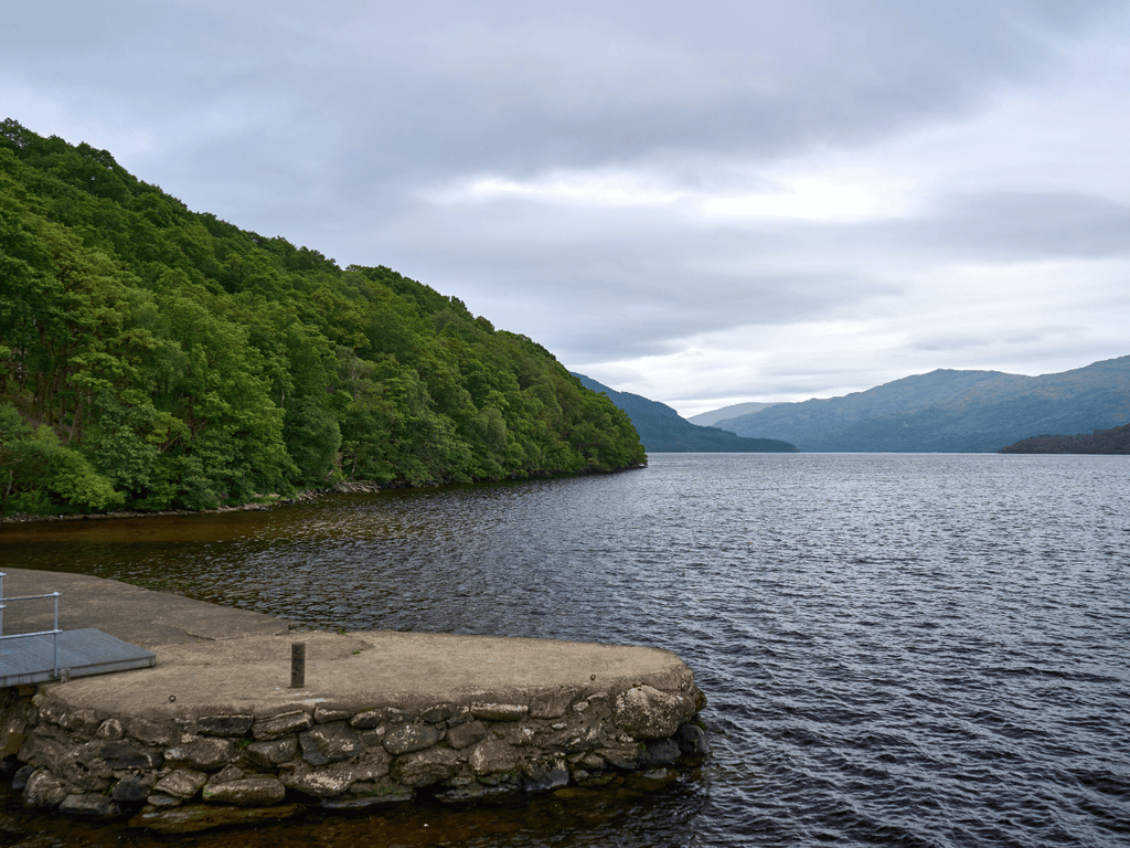 Scotland 11 Loch Lomond surrounded by wooded hills and mountains in Scotland